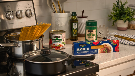 Meals & Sides — spaghetti, pasta sauce, Parmesan cheese and cooking essentials for homemade meals