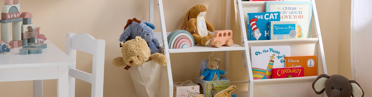 Baby bedroom with popular baby books, beige mom wooden toys and blocks, Winnie the Pooh and Peter Rabbit toys and books & more.