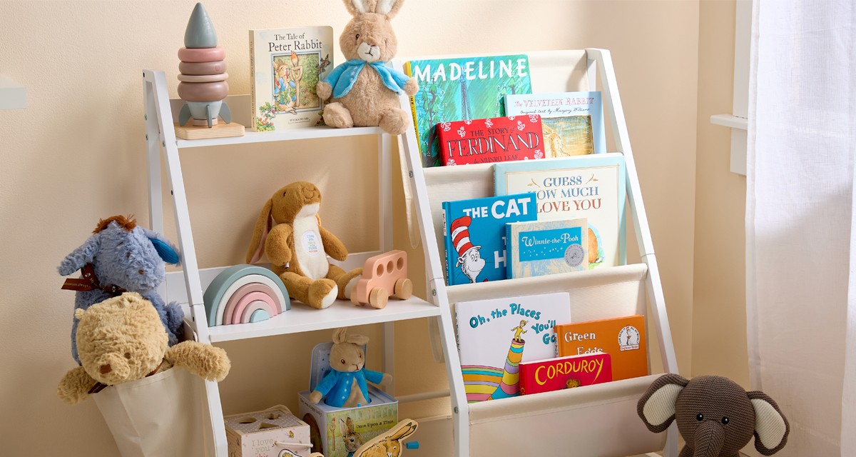 Baby bedroom with popular baby books, beige mom wooden toys and blocks, Winnie the Pooh and Peter Rabbit toys and books & more.