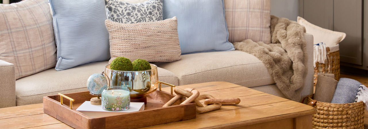 Spring home decor from pOpshelf: pillows, gold decorative bird cage, large glass candleholders, wooden tray, large lantern, wall art & more.