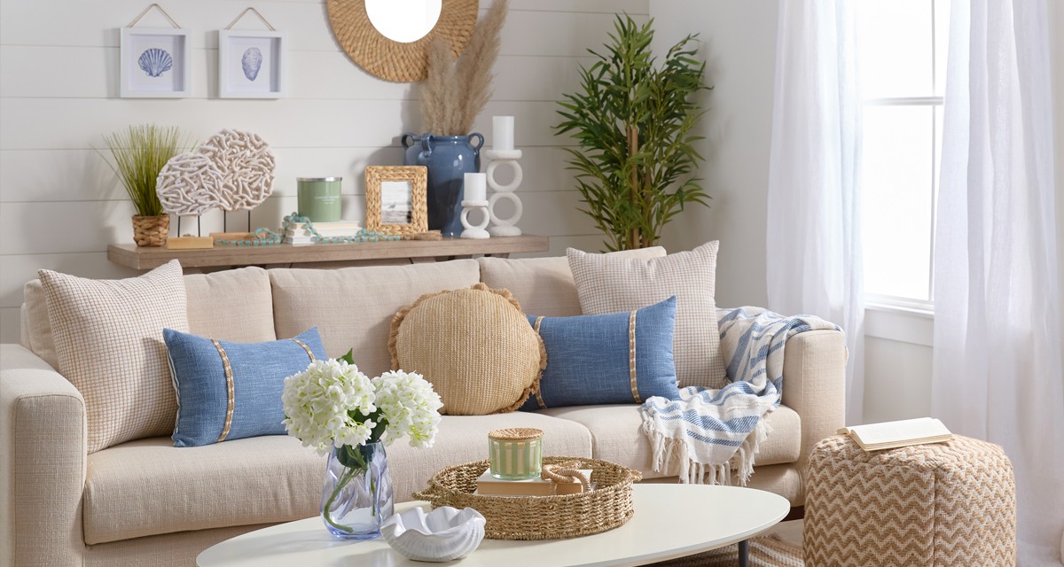 Home Shores decor collection for spring: driftwood decor, coastal pillows, beachy wall art, rattan mirror, floral, candleholders & more.