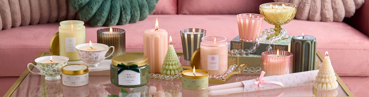 Spring candles and fragrances from pOpshelf: scented container candles, tin candles, candlesticks, and reed diffusers.
