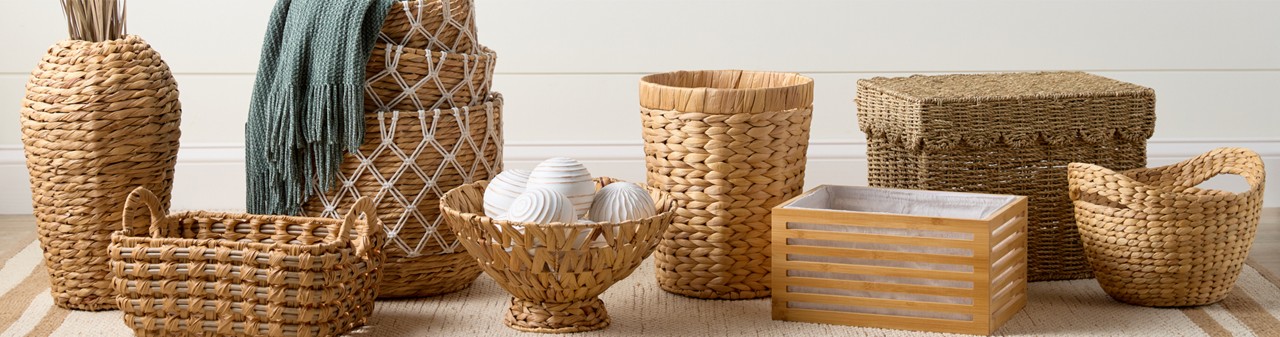 Decorative natural woven baskets, wooden boxes, and wire baskets with wooden handles from pOpshelf.