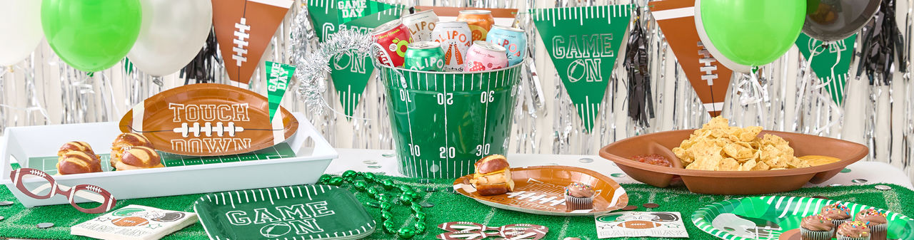Big Game tablescape with streamers, flag banners, football plates and napkins etc. 