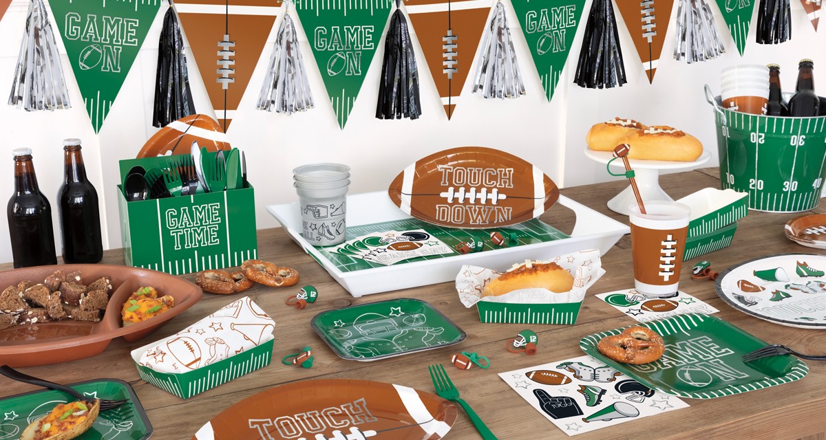 Big Game party supplies: "Touch Down" football party plates, football cups, napkins & platter, big game football flag banner, hot dog containers & more.