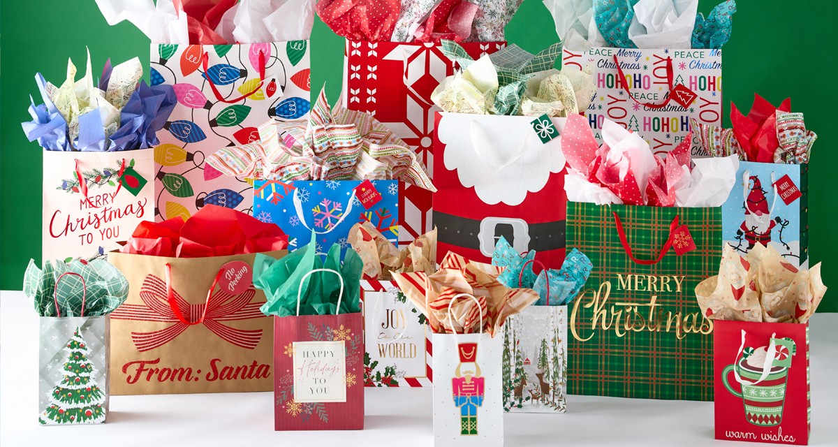 Christmas gift bags with tissue paper in a variety of bag sizes and festive holiday designs from pOpshelf.