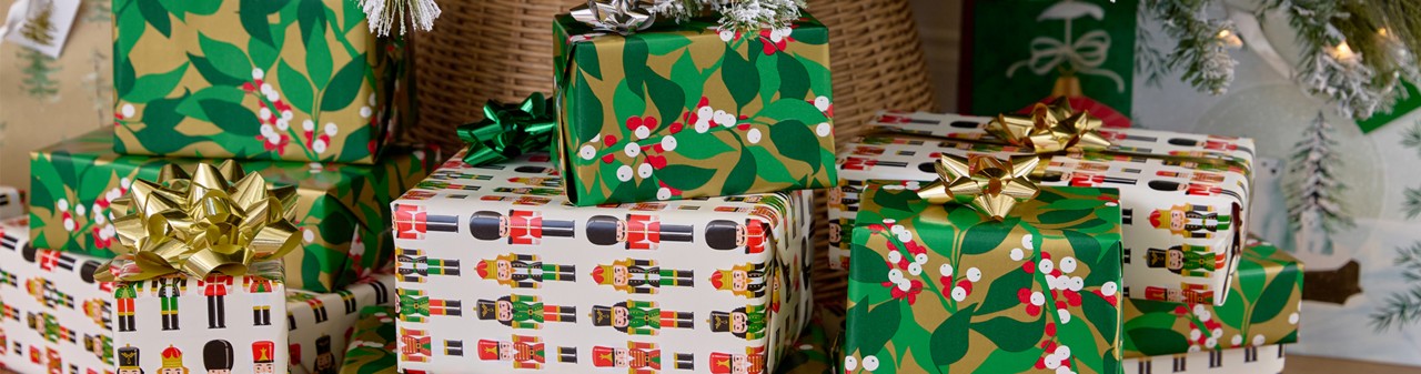 Festive Christmas gift wrap and boxes in assorted designs.