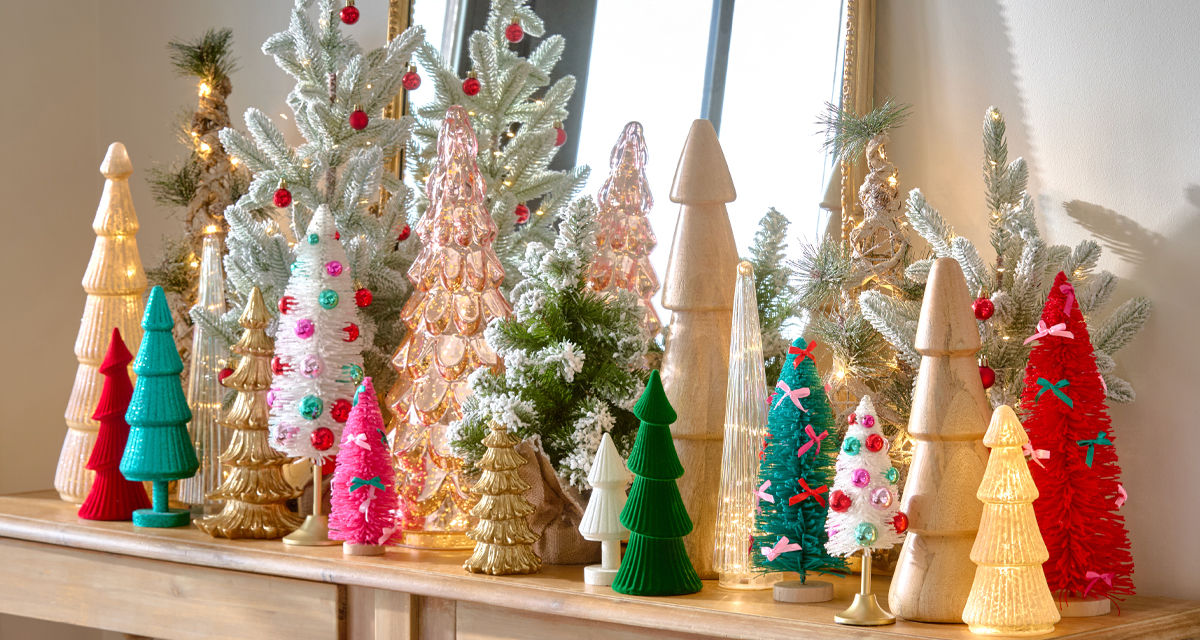 Christmas tree tabletop decor in an array of styles, colors, and materials such as wood, glass, bottlebrush, and more., and more.