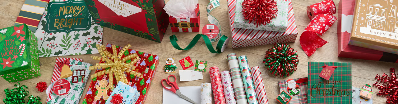 Christmas trim-a-gift with festive and affordable gift wrap, Christmas gift bags, tags, ribbon & bows.