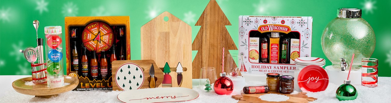 Gift ideas for the entertainer from pOpshelf: Cheese & Sausage gift set, wine glasses, wooden charcuterie boards, bar essentials, hot sauce set & more.