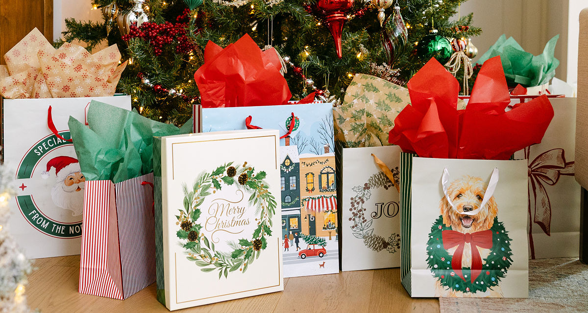Christmas gift bags with tissue paper in a variety of bag sizes and festive holiday designs from pOpshelf.