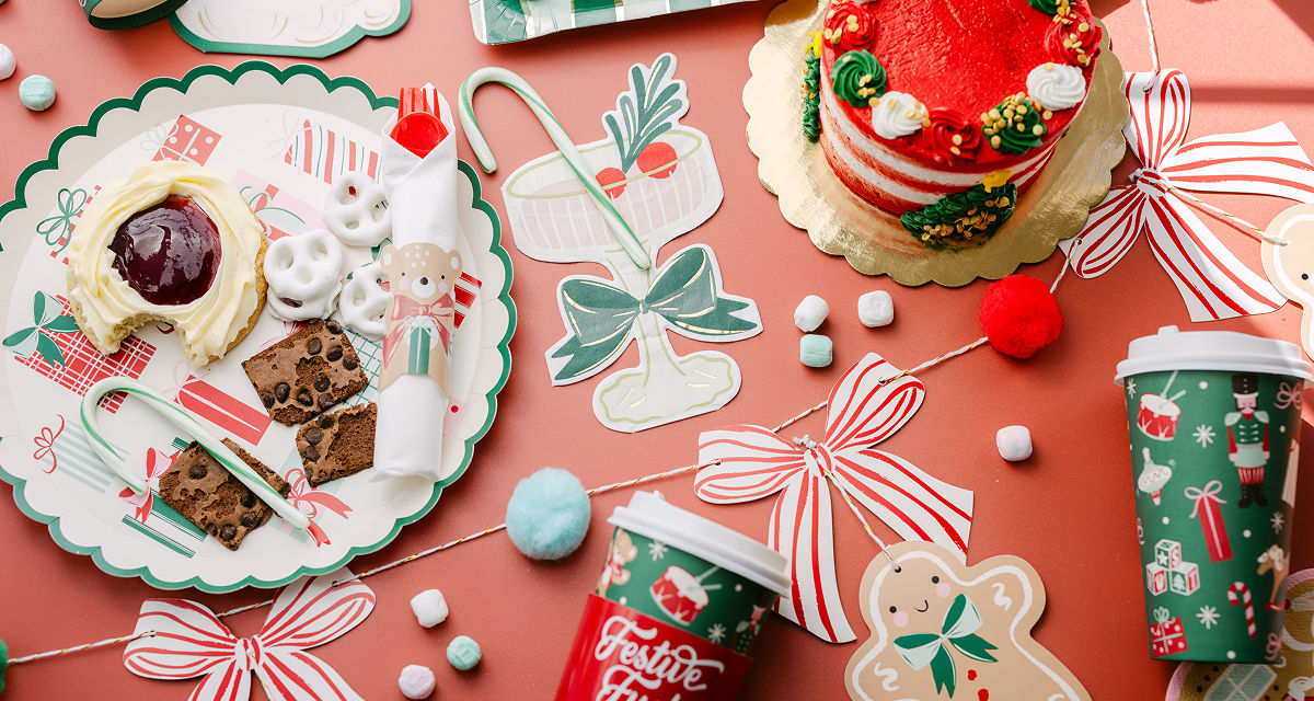 Christmas party table with festive party supplies.