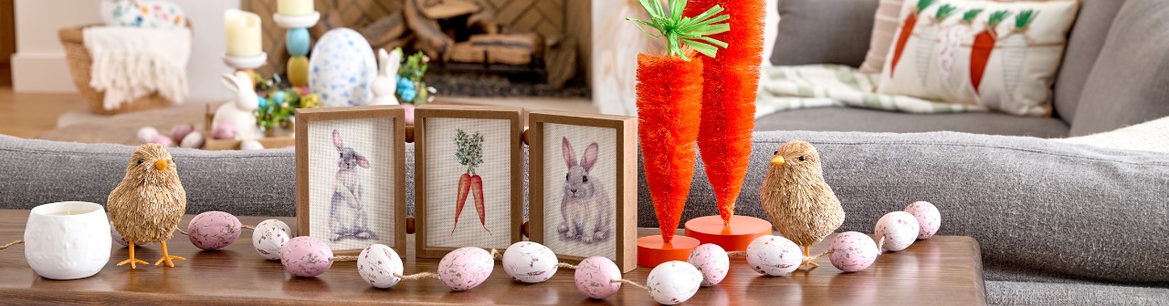 Living room decorated with Easter decor from pOpshelf: bottlebrush carrots, rattan bunnies and carrots, egg garland, bunny & carrot decor, and more.