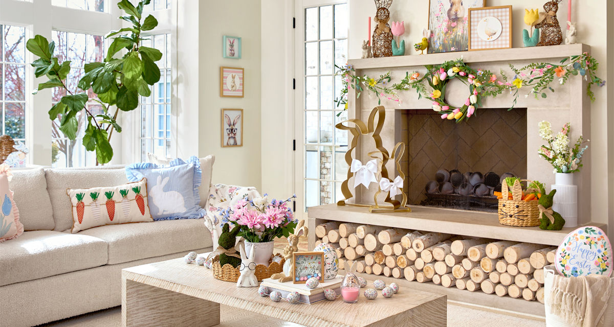Living room decorated with Easter decor from pOpshelf: metal and rattan bunnies, framed bunny art, egg garland, pillows, bunny & carrot decor, and more.