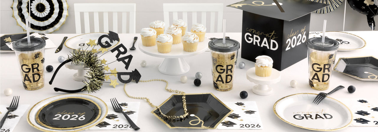 2025 graduation party table with grad plates, napkins, cups, decorations, balloons & more from pOpshelf.