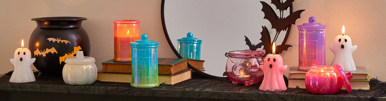 Cute ghost-shaped candles, skull taper candles, spooky candelabra, colorful jar candles & more from pOpshelf.