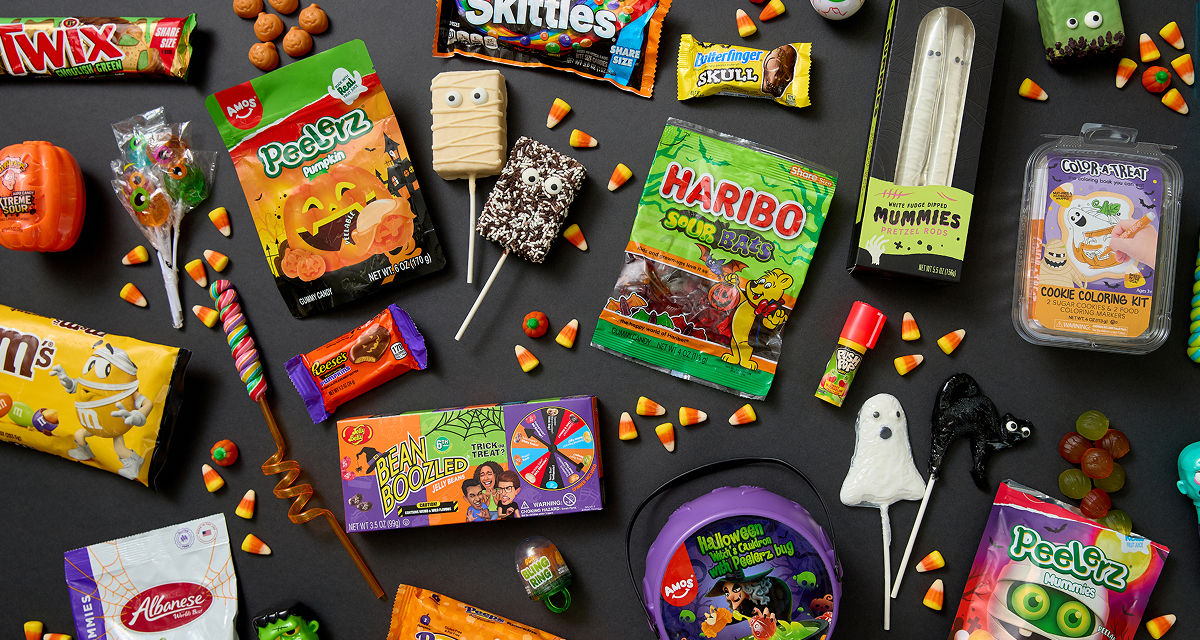 Various colorful Halloween candy and treats: Peelerz, gummy candy, decorated cookie and rice krispy treat pops, Reese's Pumpkins, candy corn & more.