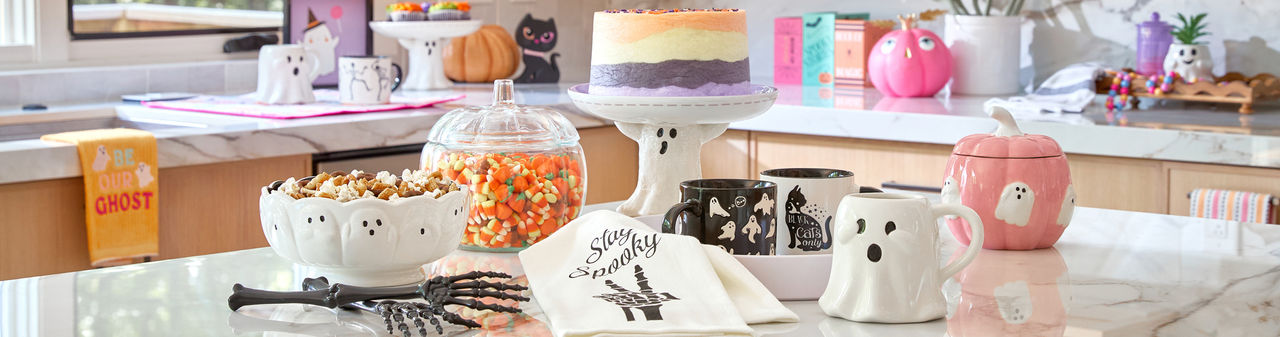 Halloween kitchen and houseware from pOpshelf: kitchen towels, ghost cake plate, pink ghost and pumpkin canister, Halloween mugs & more. essentials: spider web placemats and table runner, ghost sale & pepper shakers, web serving bowl & more.