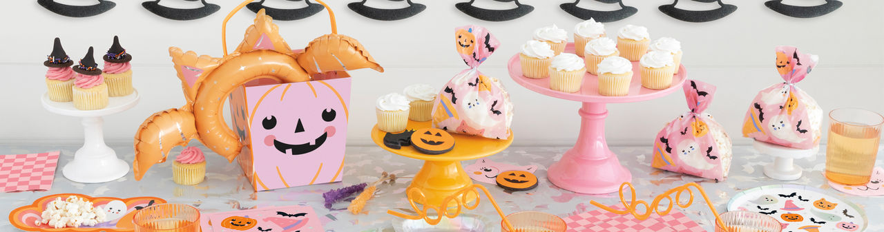 Halloween pastel party supplies with black accents: ghosts, witches hats, jack-o-lanterns, bats & more..