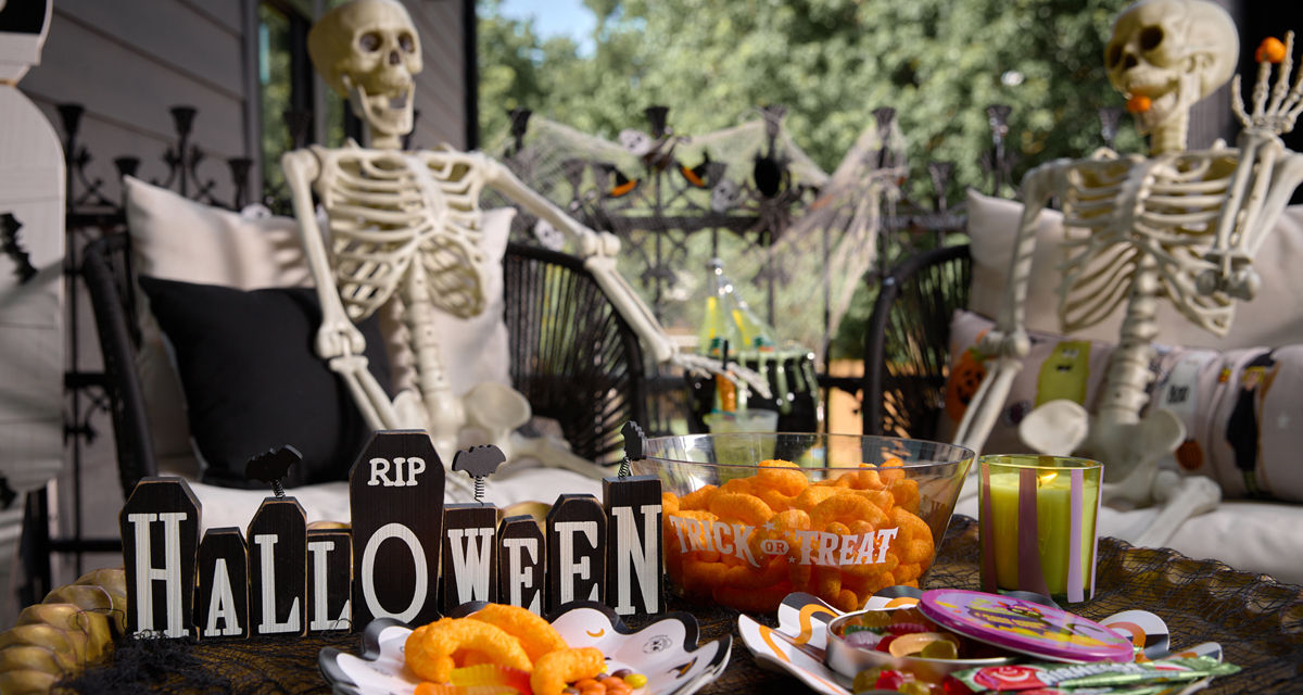 Halloween porch party with skeletons and party supplies from pOpshelf.