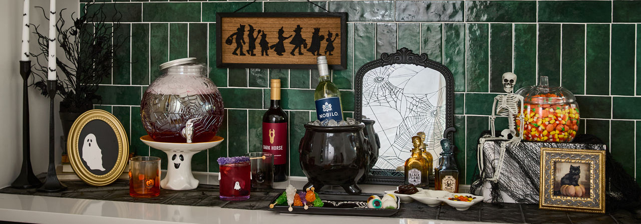 Halloween houseware from pOpshelf: drink dispenser, ghost cake stand, icon Halloween glasses, and more.