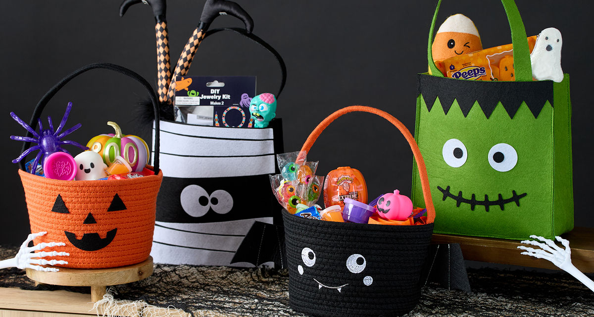 Halloween trick-or-treat buckets and pails filled with candy and goodies from pOpshelf. 