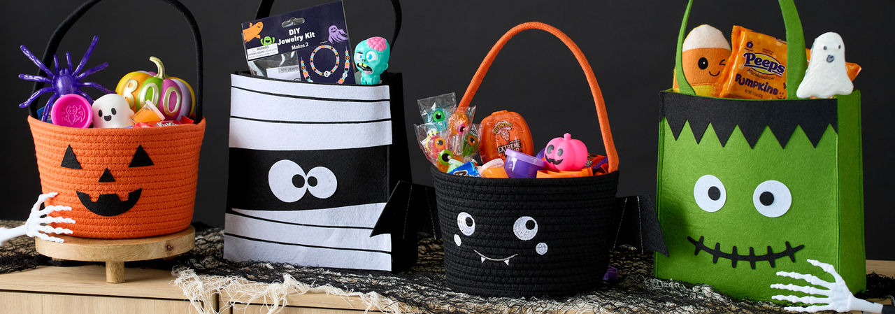 Halloween trick-or-treat buckets and pails filled with candy and goodies from pOpshelf. 