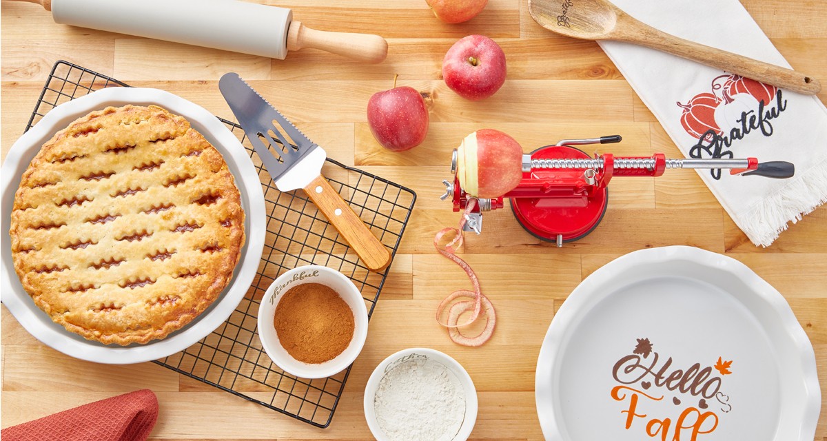 Apple peeler/corer/slicer, ceramic fall pie plate with server, fall kitchen towels, fall ramekins, rolling pin & more.