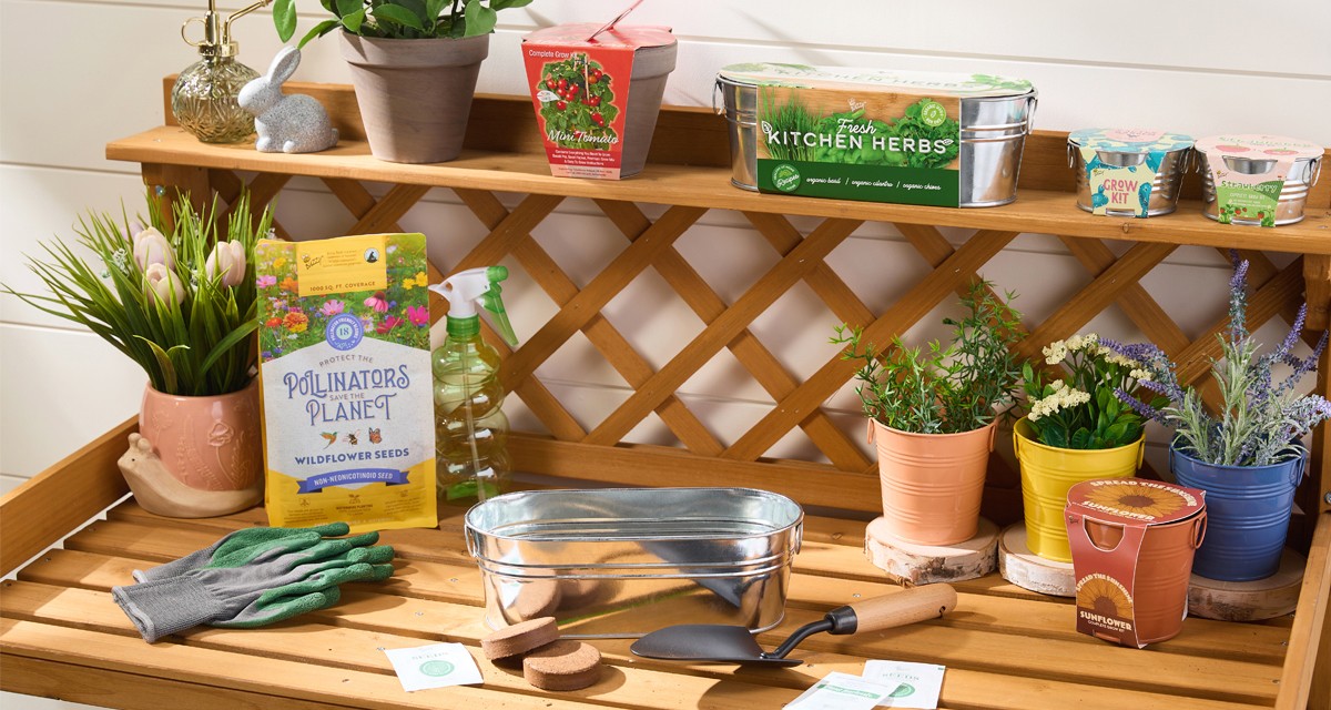 Potting bench with gardening tools, watering can, garden pots, and gardening seeds, bulbs, and grow kits from pOpshelf.
