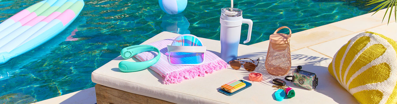 Summer apparel and accessories from pOpshelf: large tote, beach towels, slides, visor, keychain, bag tag & more.