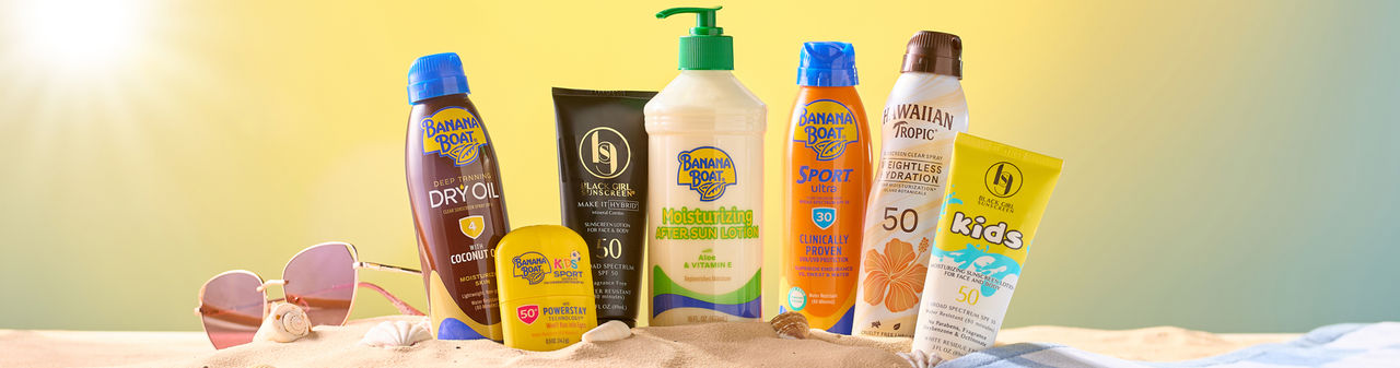 Sunscreen for the family in the sand at the beach.