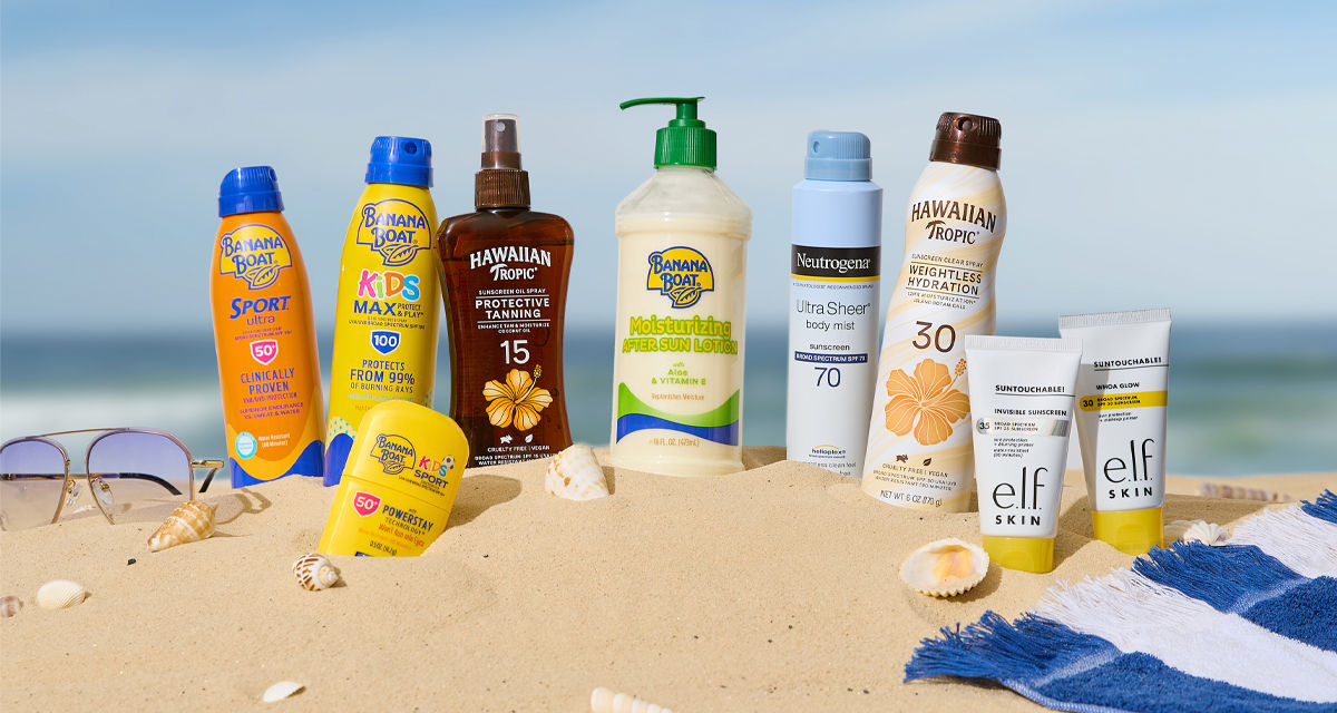 Sunscreen for the family in the sand at the beach.
