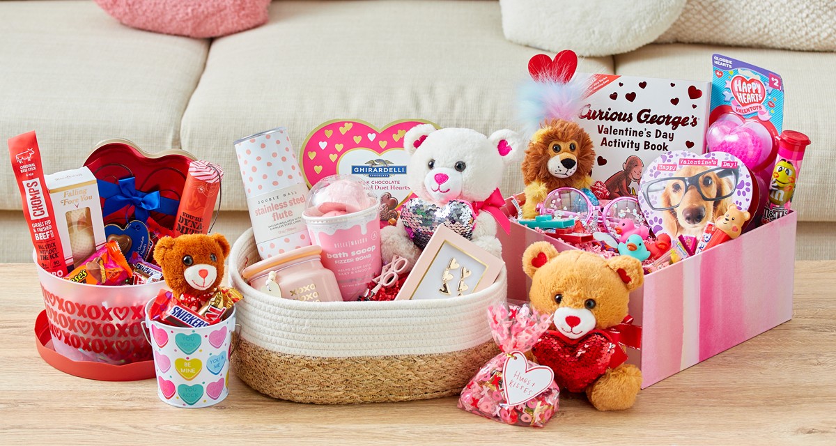 Gift baskets full of Valentine's candy, plush, and other gifts for her, him, and kids.