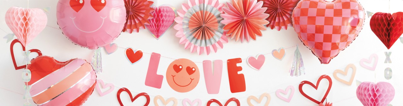 Valentine's party supplies from pOpshelf: paper party supplies, heart sippy cups, LOVE balloons, heart foil backdrop, favor bags, and more. 