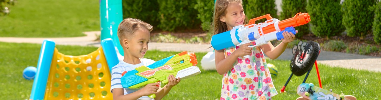 Kids playing with toys from pOpshelf: water blasters, play balls, yard games, sprinklers & more.