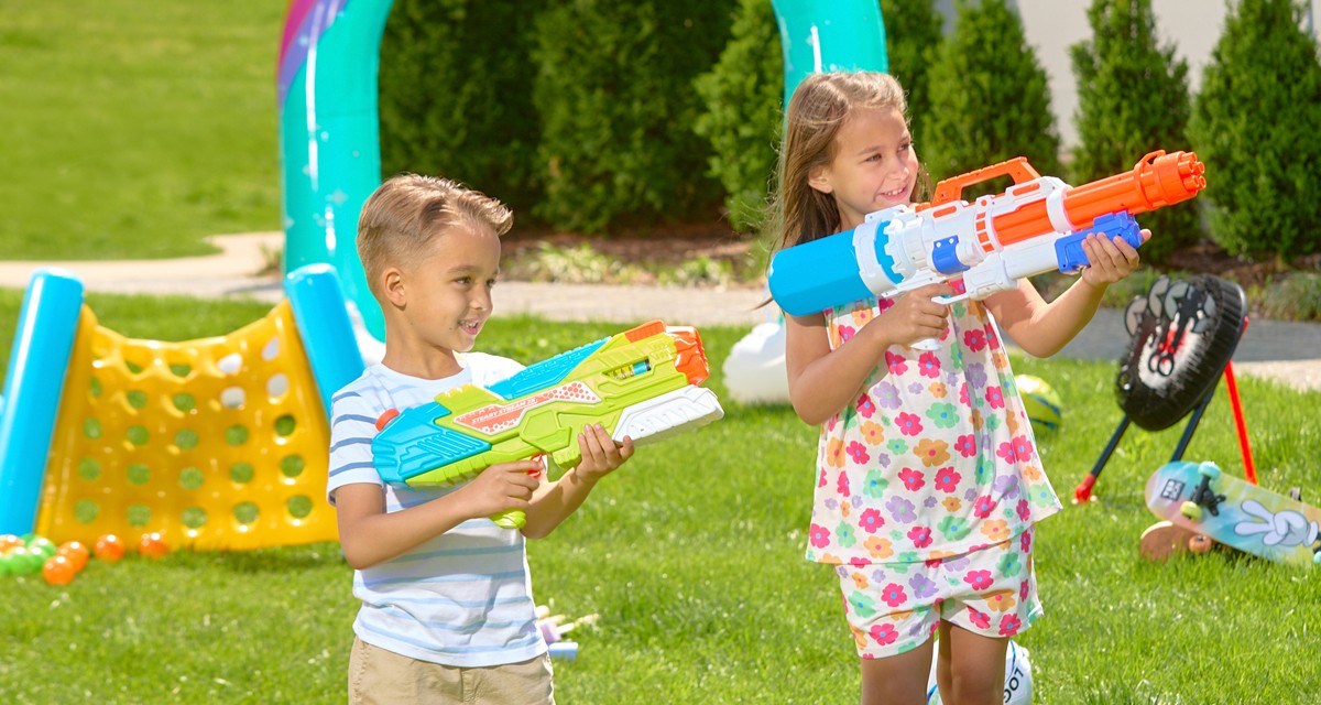 Kids playing with toys from pOpshelf: water blasters, play balls, yard games, sprinklers & more.