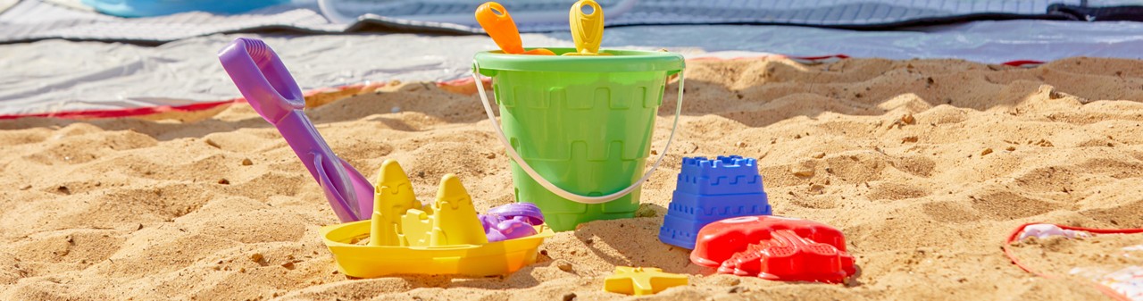 Stacking sand toy set with sand pail, sand sifters, and sand molds from pOpshelf.