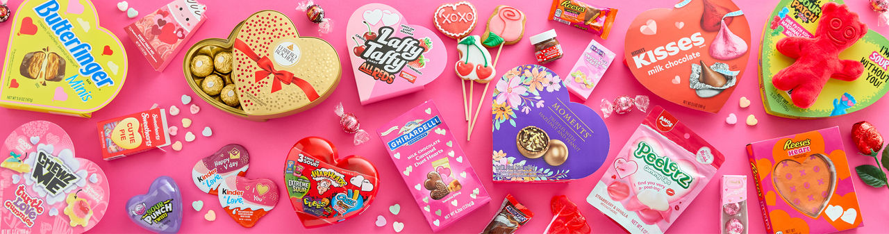 Valentine's candy favorites from pOpshelf: Heart-shaped boxed candy, Reese's cups,  Russell Stover, Ferrero Rocher, conversation hearts, chocolate roses, Sour Patch & more.