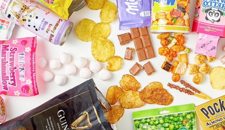 variety of snack foods opened with products coming out on tabletop
