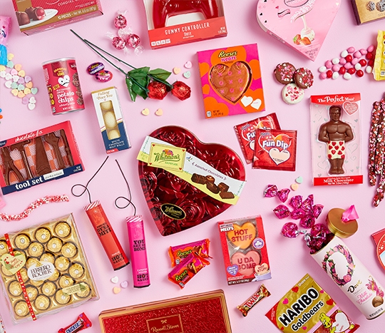 Valentine's Day candy gifts: heart-shaped boxed candy, Ferrero Rocher, Dove chocolate, Fun Dip, Nerds & more.