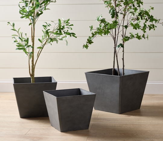 Dark gray square planters in various sizes.