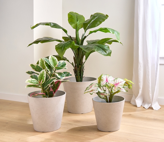 Light gray round planters in various sizes.
