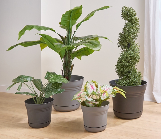 Dark and light gray round planters in various sizes.