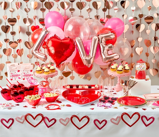 Valentine's party supplies from pOpshelf: paper party supplies, heart sippy cups, LOVE balloons, heart foil backdrop, favor bags, and more. 