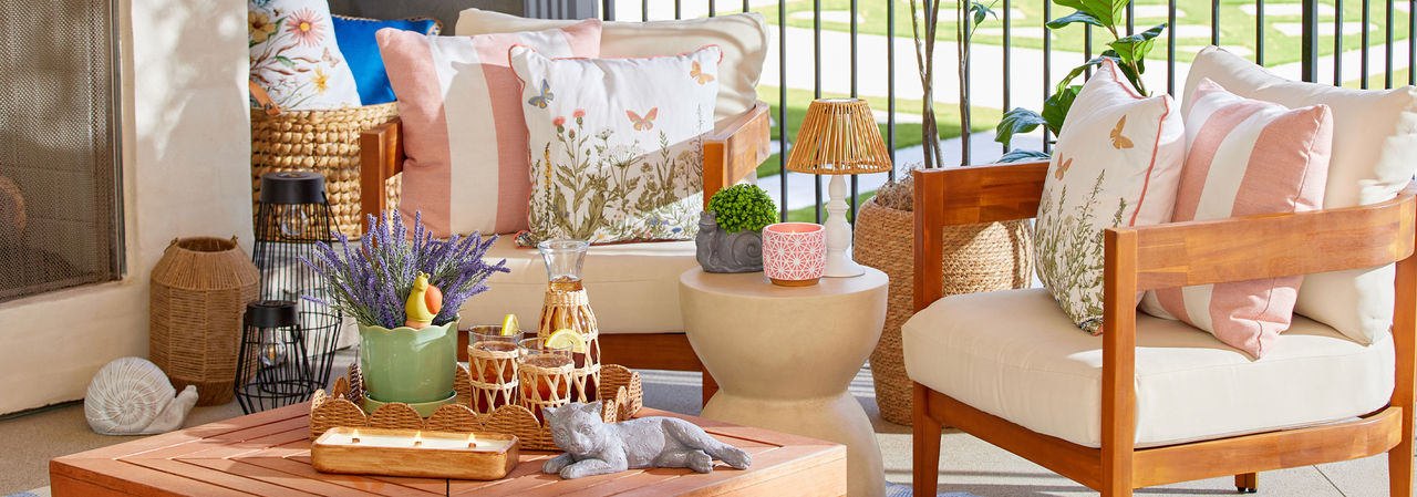 Patio decorated with new lawn & garden decor, pillows, planters, and pots from pOpshelf.