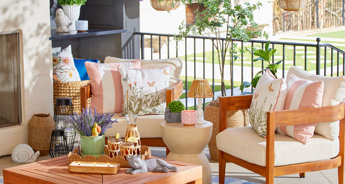 Patio decorated with new lawn & garden decor, pillows, planters, and pots from pOpshelf.