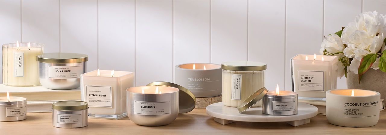 Spring candles and fragrances from pOpshelf: scented container candles, tin candles, candlesticks, and reed diffusers.
